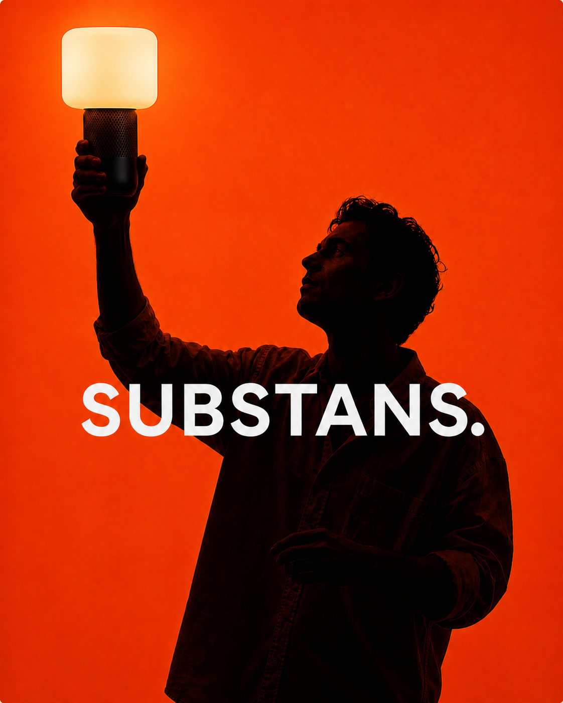 Man holding the sustainable 3D-printed Lumo smart lamp against a vivid orange background.