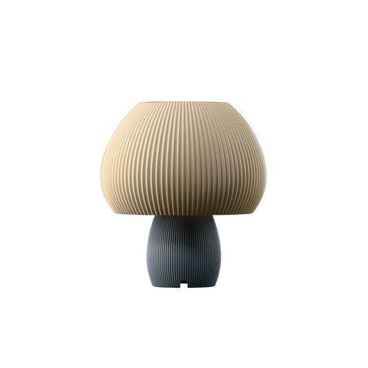 A modern mushroom-shaped table lamp with a pleated beige shade and a ribbed dark gray-blue base, centered on a plain white background.