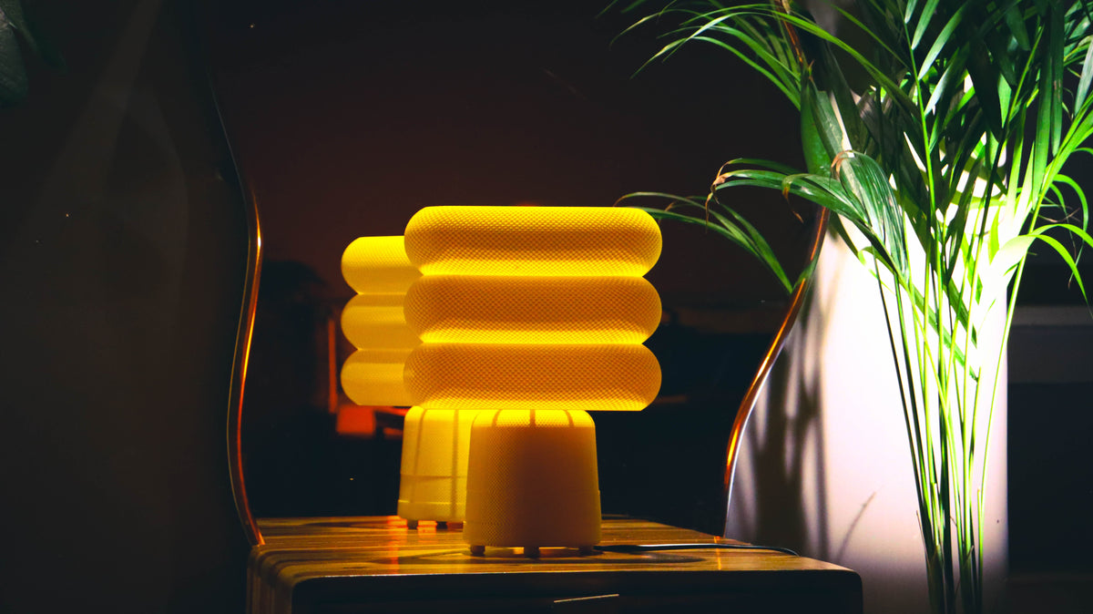 Spiral twist table lamp, triangular funnel shape, yellow mesh texture