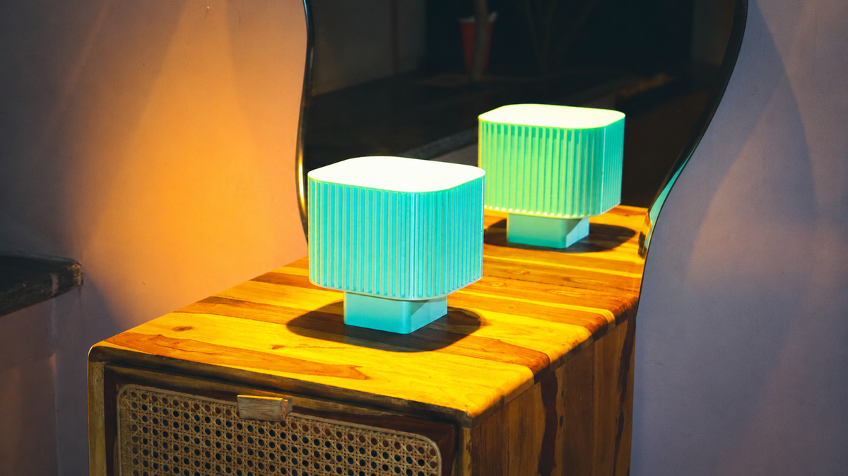 Sage green fluted drum lamp with vertical ribbing and slim stand