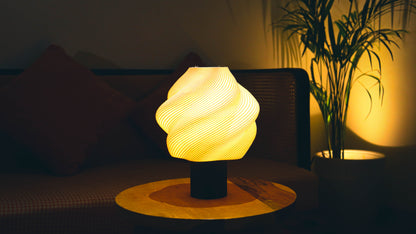 Soft serve Lamp glowing warmly on wooden side table in cozy living room